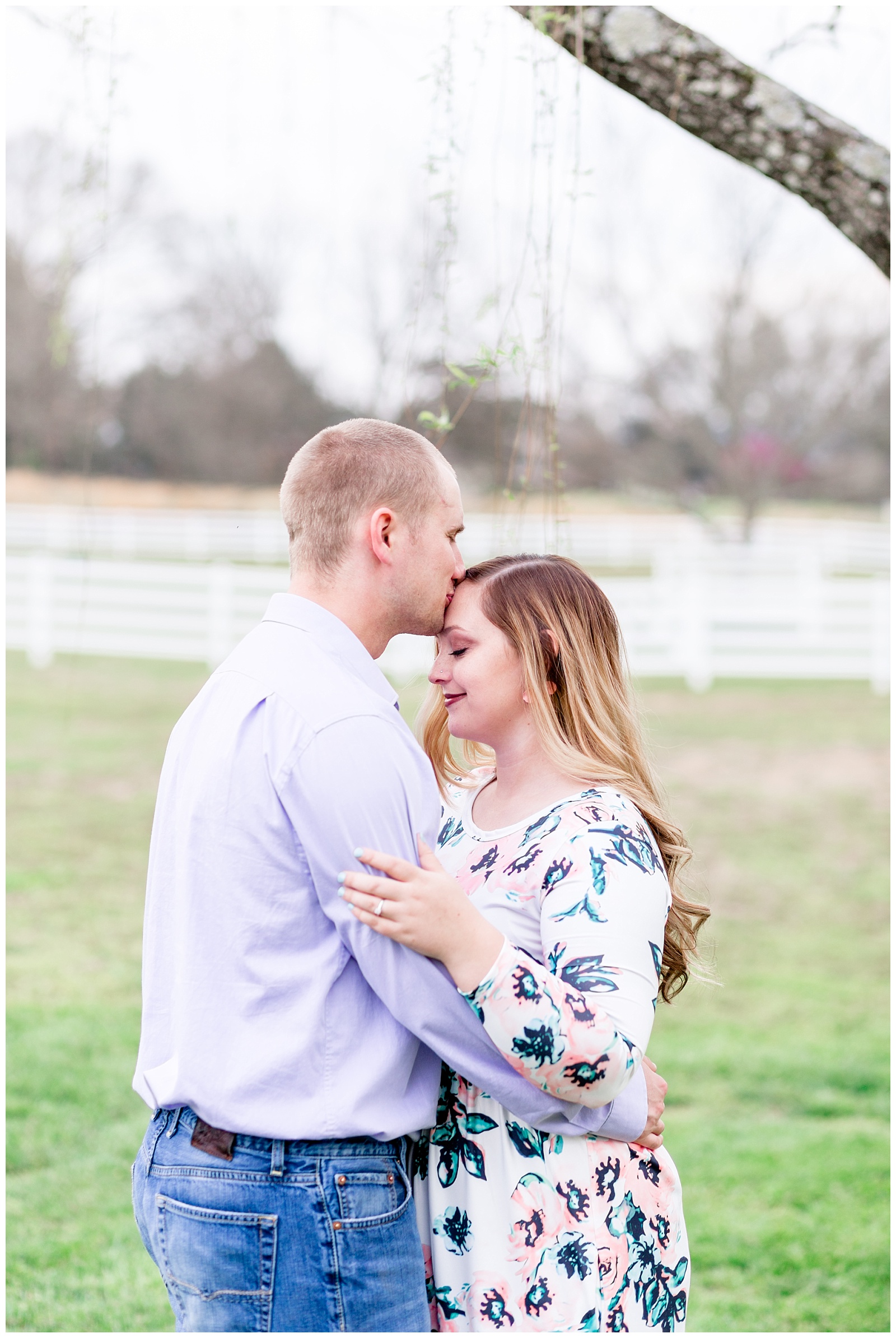 Southern Farm Engagement Session with Pastel and Floral Outfits under a Weeping Willow