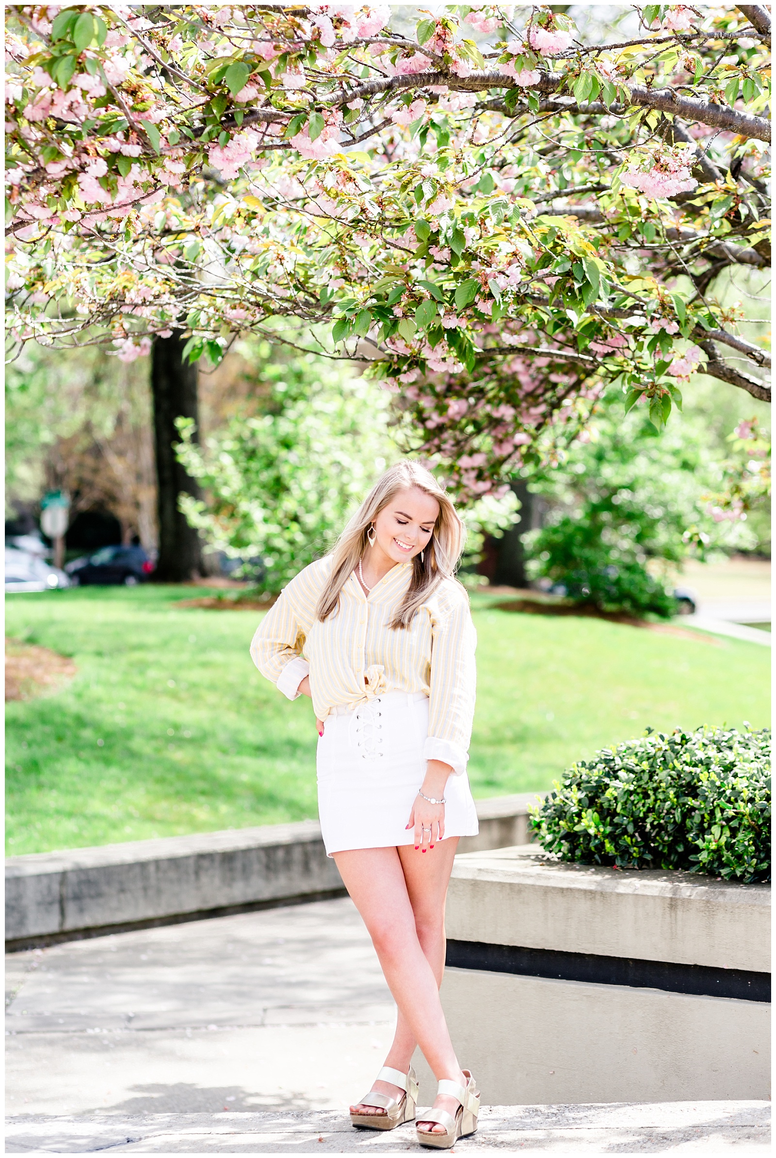 Downtown Spring Senior Girl Session with A Blue Jean Jacket, Yellow and Blue Striped Tied Flannel, and a White Skirt