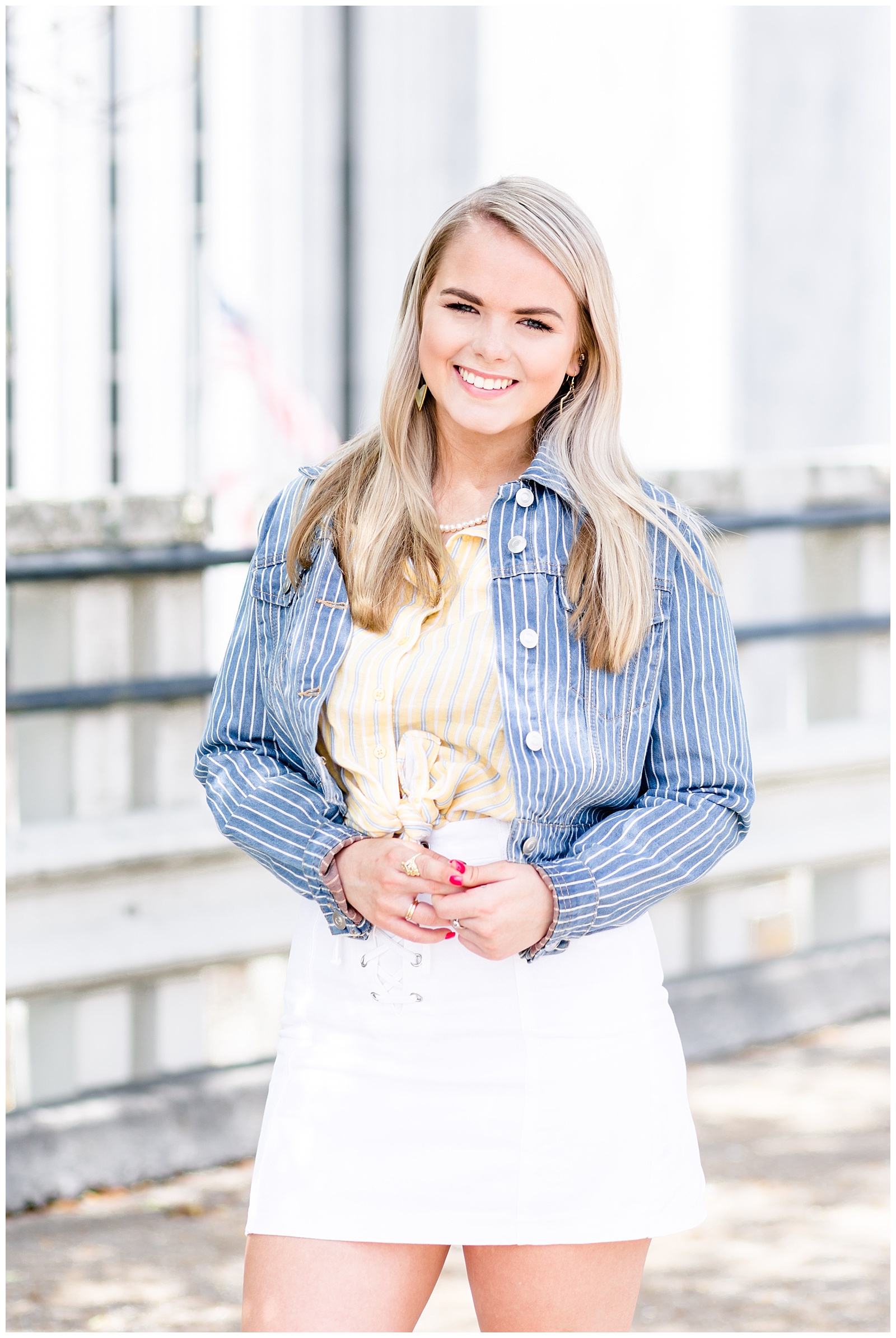 Downtown Senior Girl Session on a Rooftop with A Blue Jean Jacket, Yellow and Blue Striped Tied Flannel, and a White Skirt