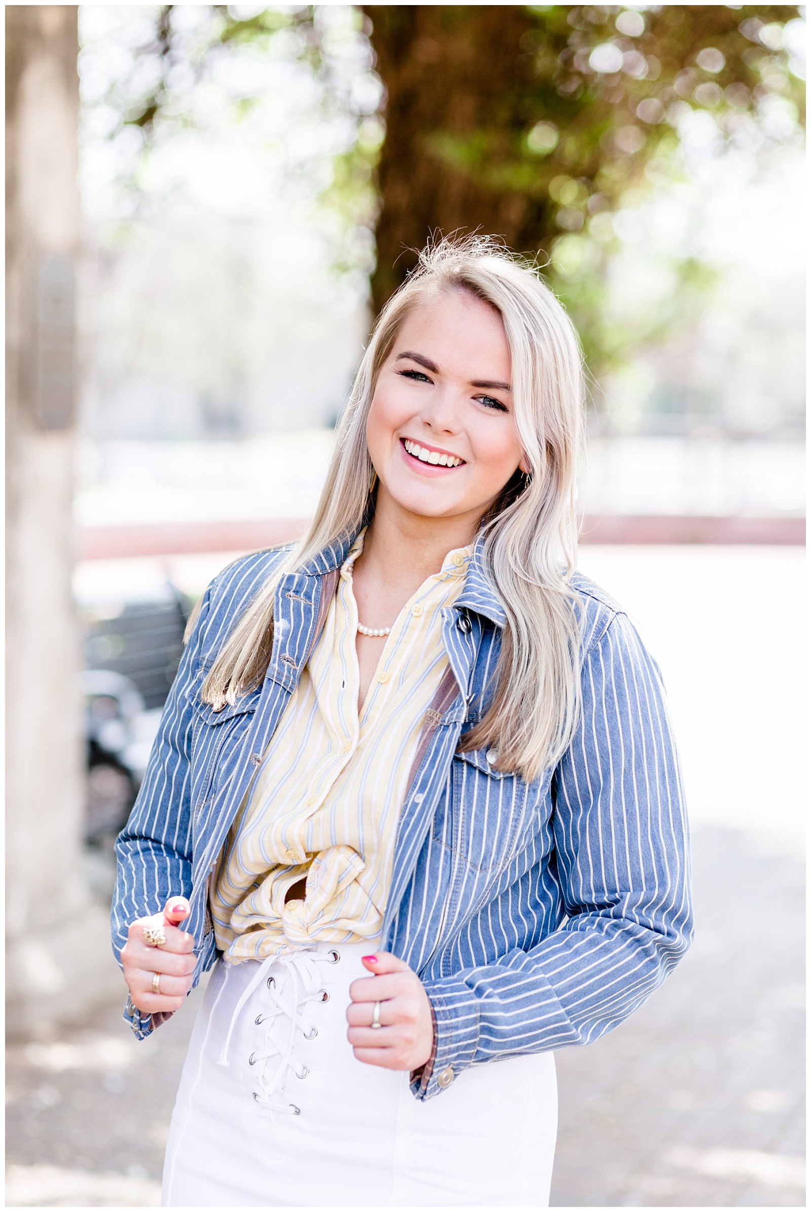 Downtown Senior Girl Session on a Rooftop with A Blue Jean Jacket, Yellow and Blue Striped Tied Flannel, and a White Skirt