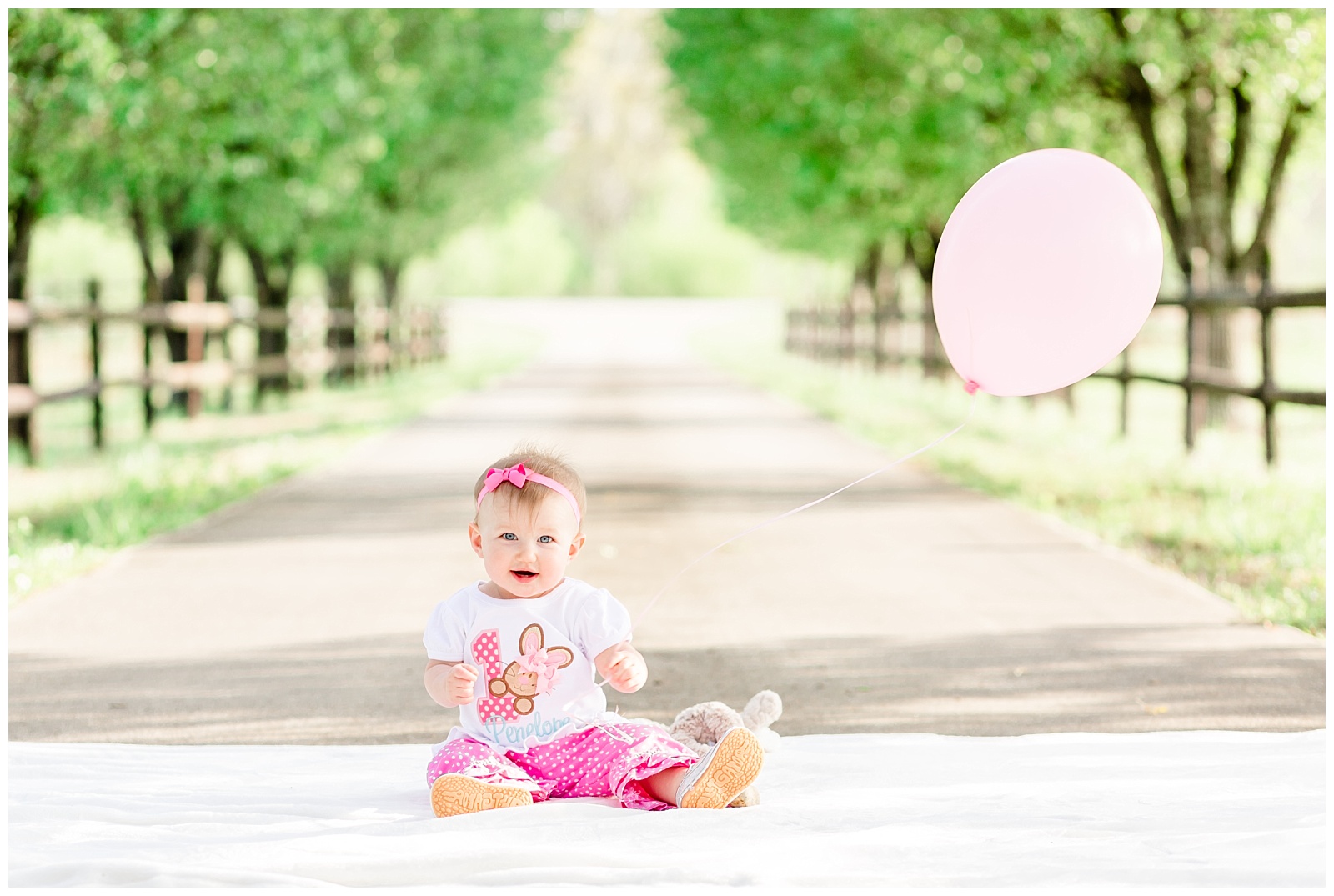 Spring One Year Old Birthday Session for Baby Girl with Different Shades of Pink