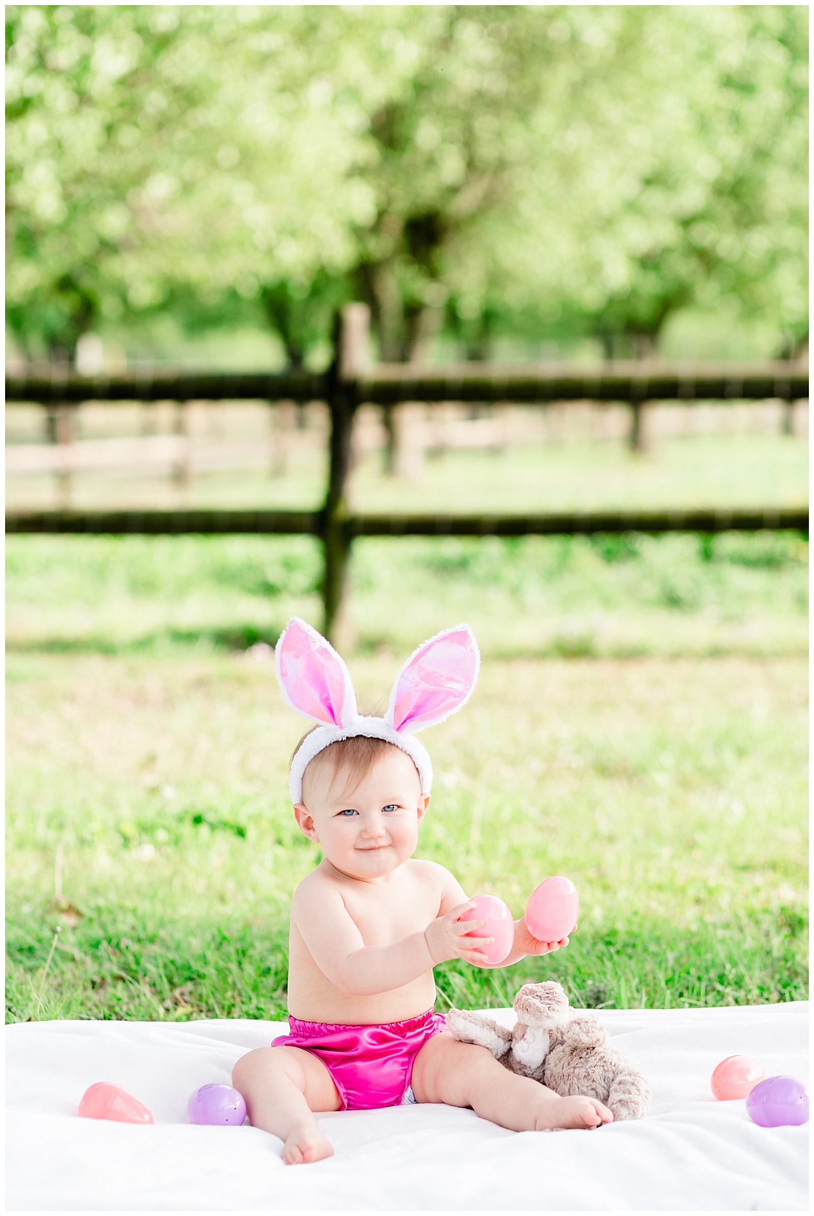 Easter Spring One Year Old Birthday Session for Baby Girl with Different Shades of Pink, Easter Eggs and Bunny Ears