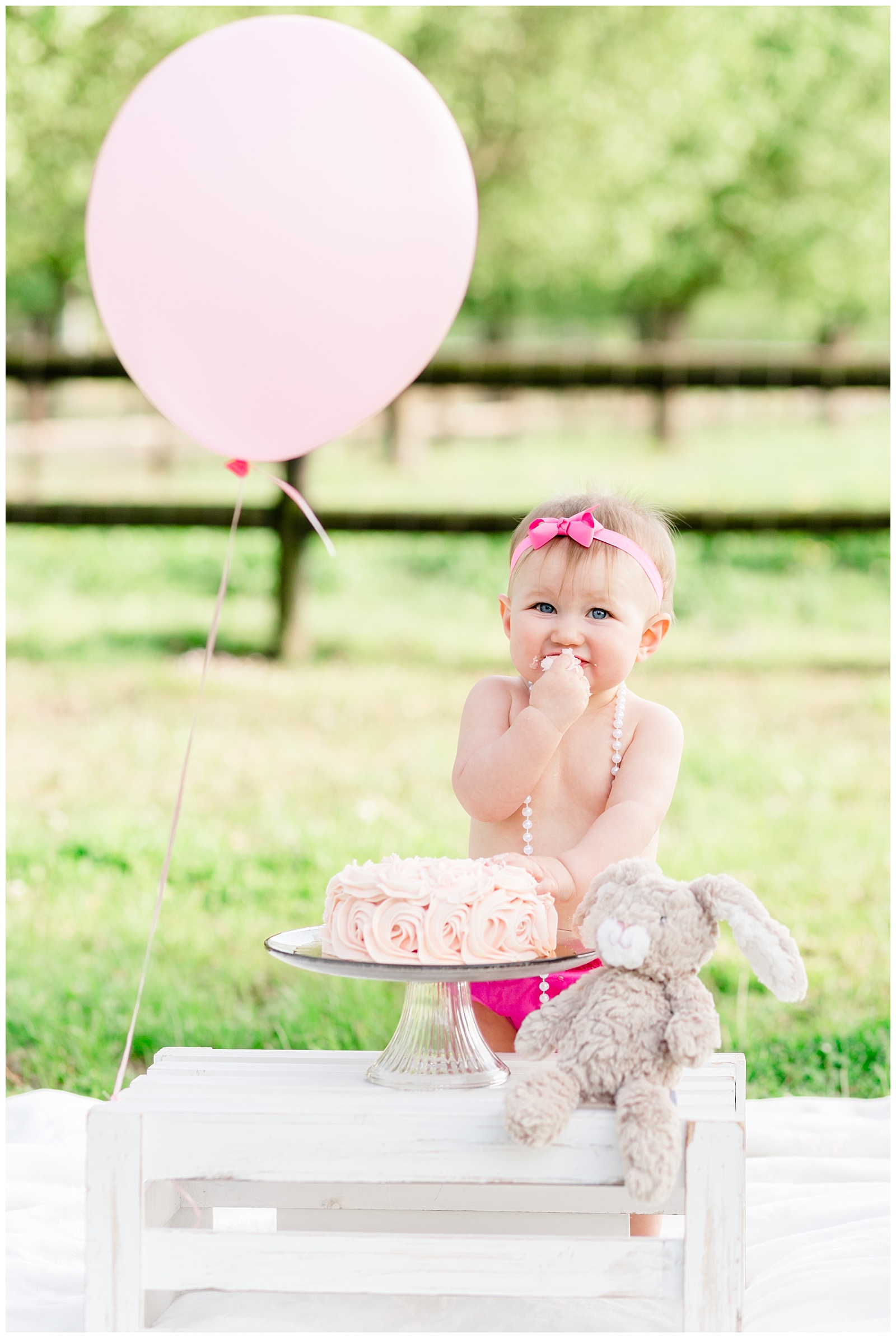Cake Smash and One Year Old Birthday Session for Baby Girl with Different Shades of Pink, A Pink Cake and Pink Balloon