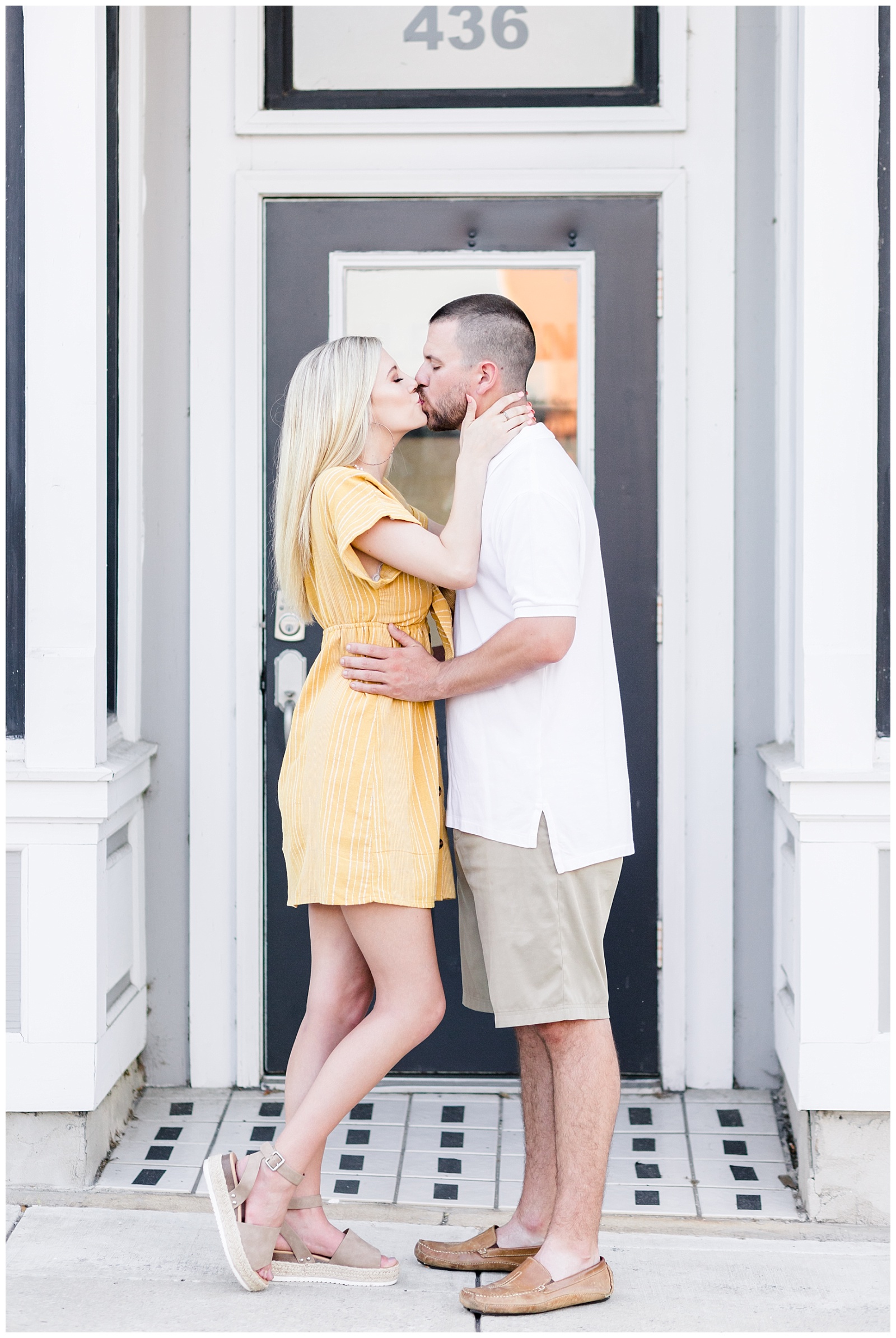 downtown engagement session picture with yellow and white outfits