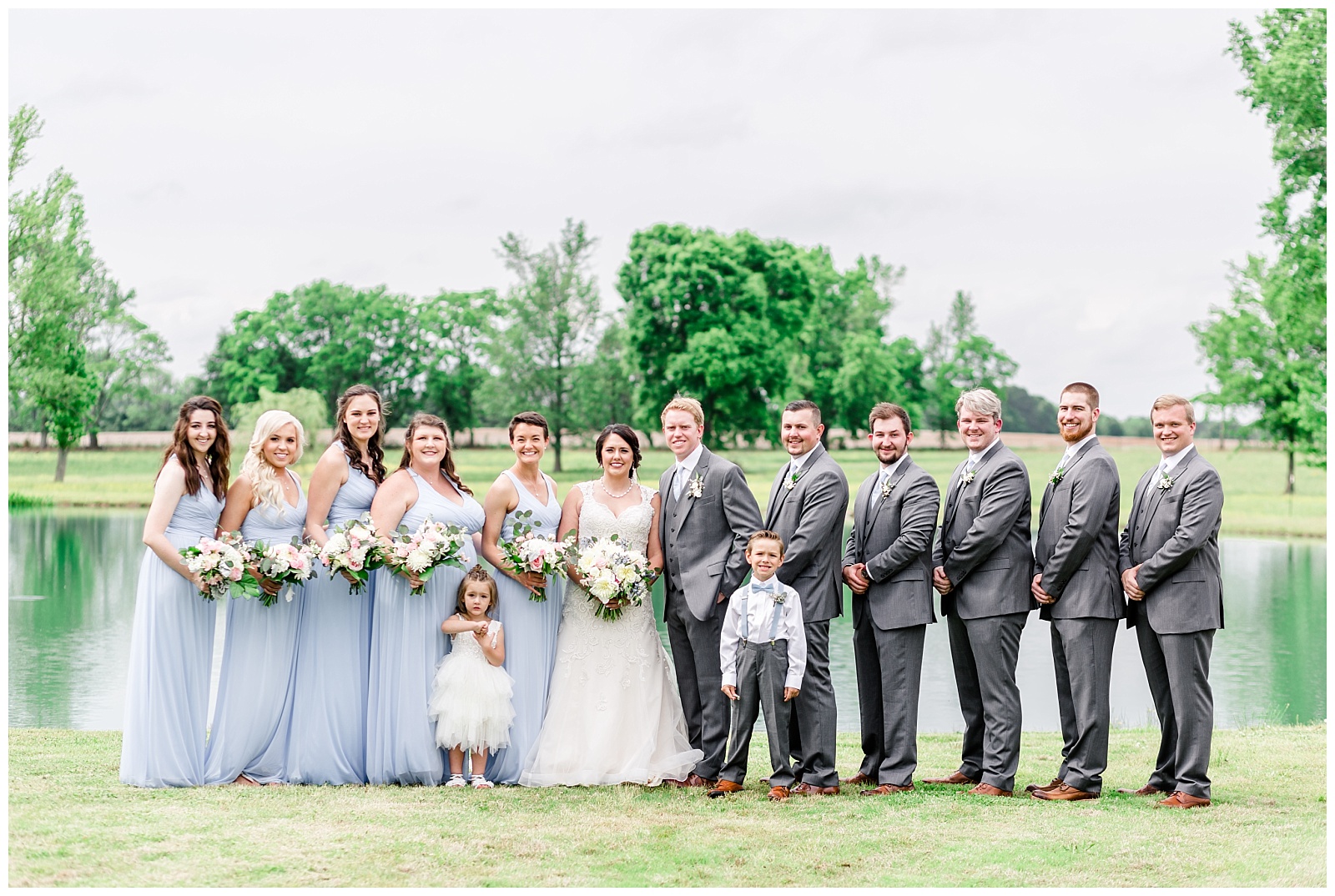 Bridal party shot at rustic farm venue with blue and grey details