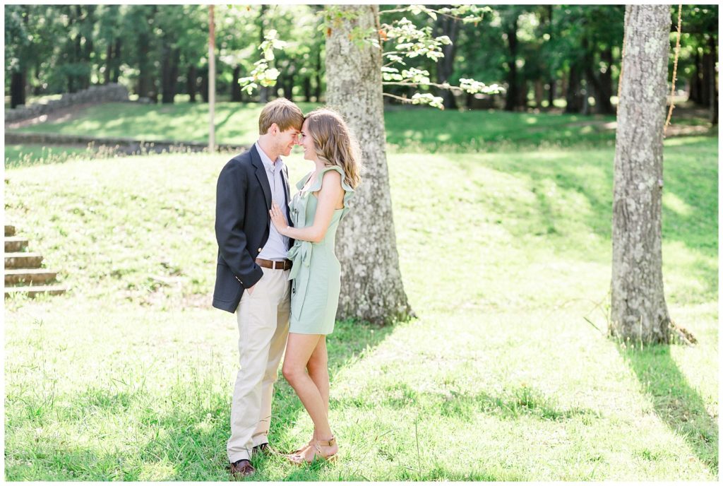 monte sano mountain state park engagement session in a boutique blue dress and a navy blazer on lookout overlooking the Tennessee valley mountains
