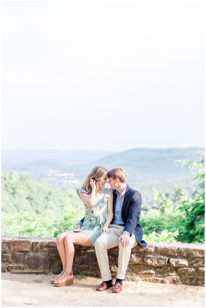 monte sano mountain state park engagement session in a boutique blue dress and a navy blazer on lookout overlooking the Tennessee valley mountains