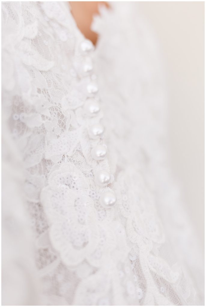 fairytale wedding gown with buttons and floral lace