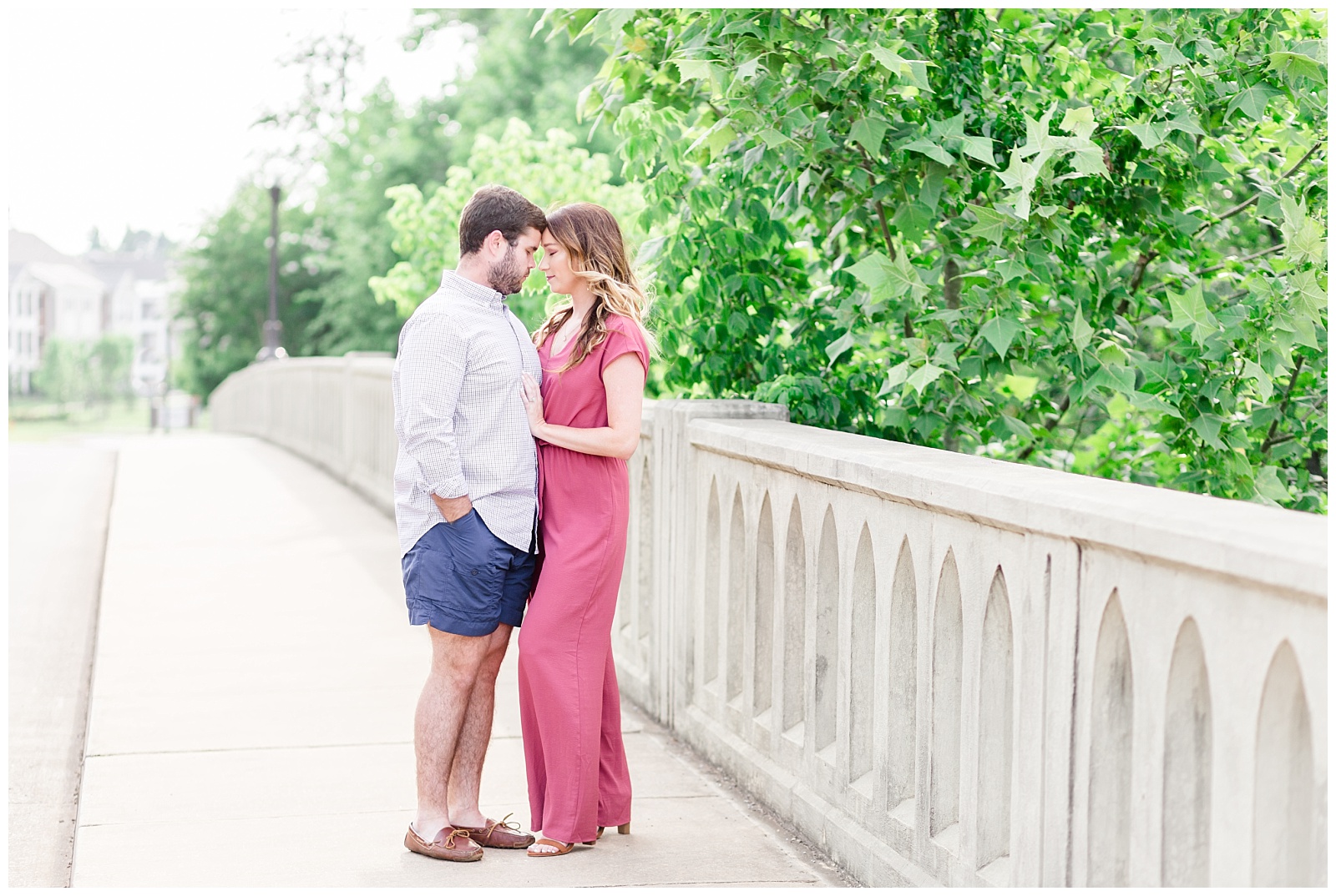 Downtown summer engagement session with dog in a red jumpsuit