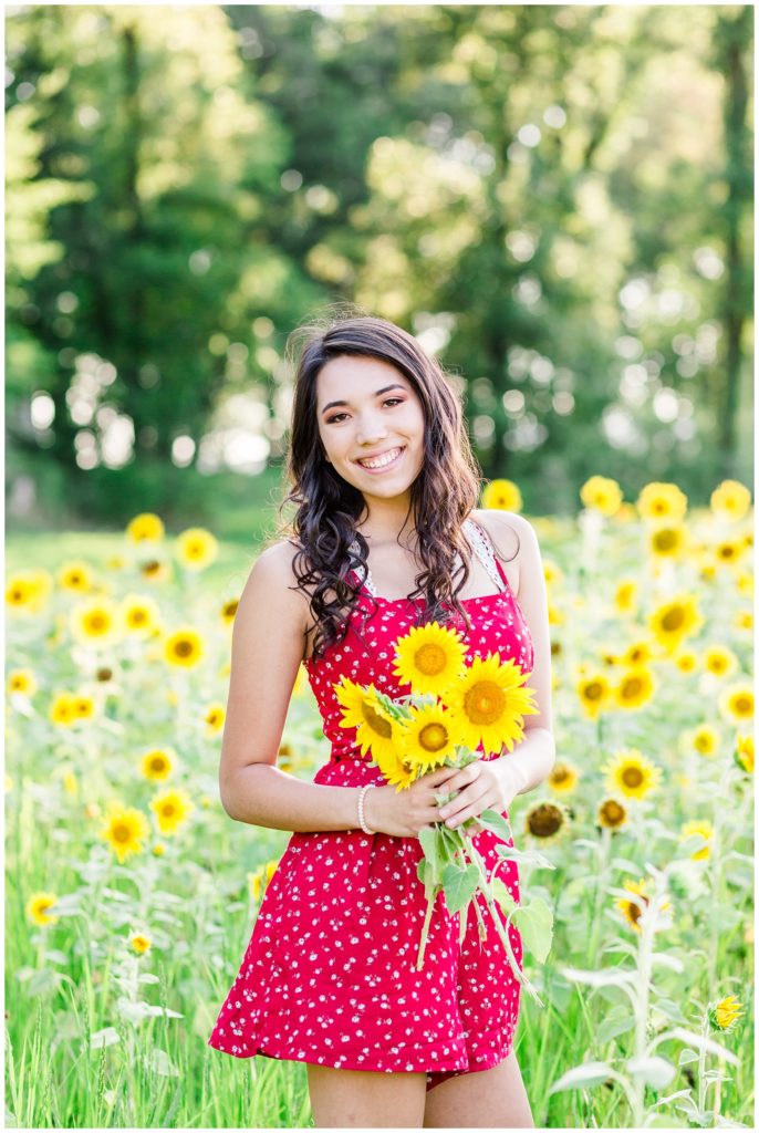 sunflower patch senior session in bright red dress