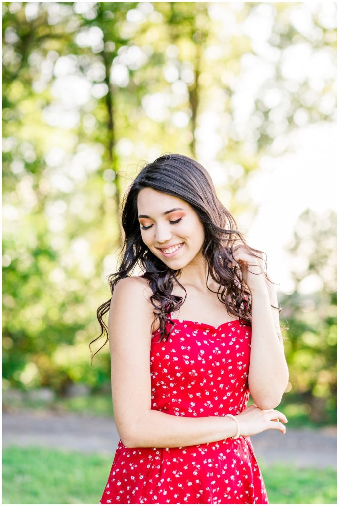 outdoor nature senior session in bright red dress