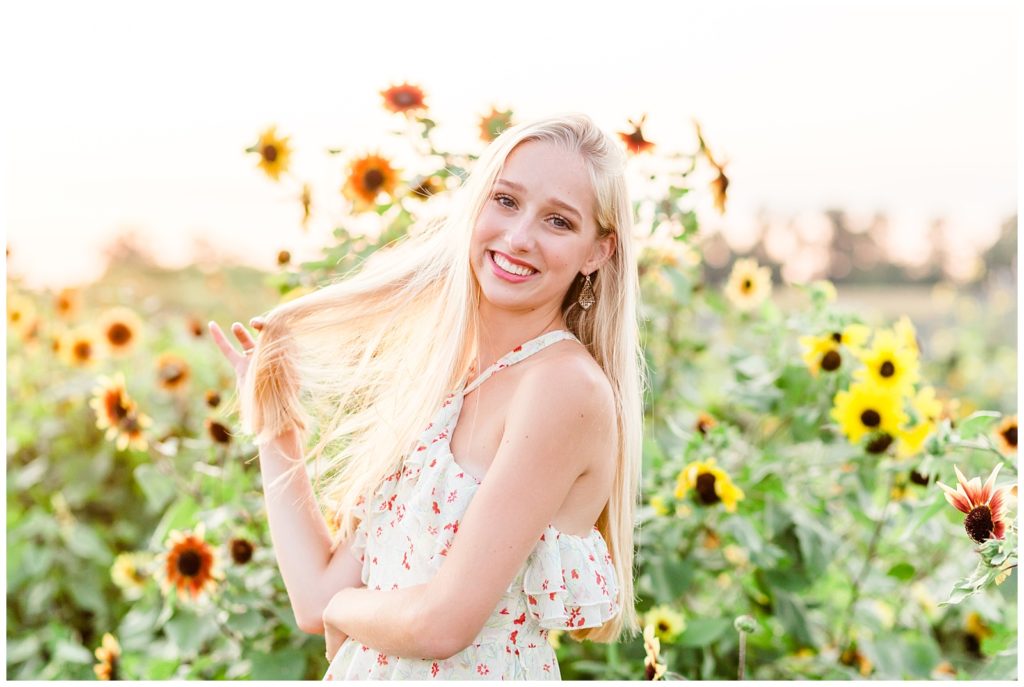 senior session in colorful flower field with floral maxi dress