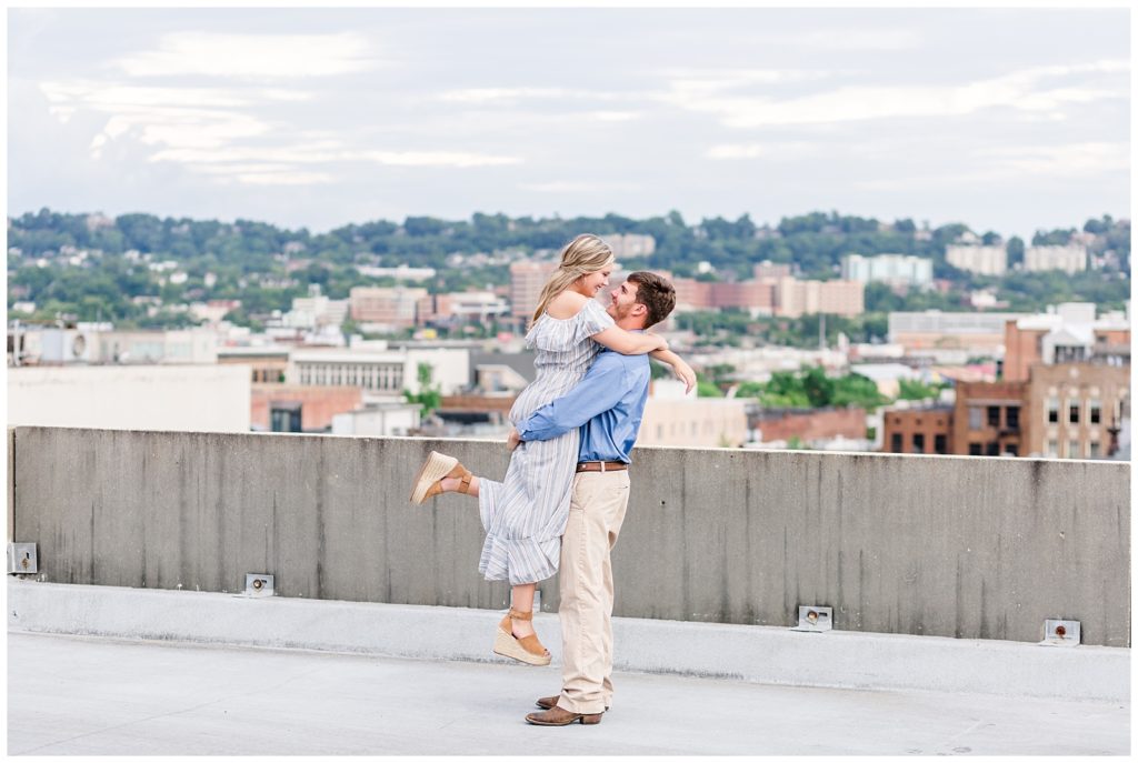 downtown birmingham rooftop engagement session photo in blue striped dress and blue button up
