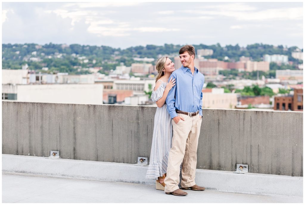 downtown birmingham rooftop engagement session photo in blue striped dress and blue button up