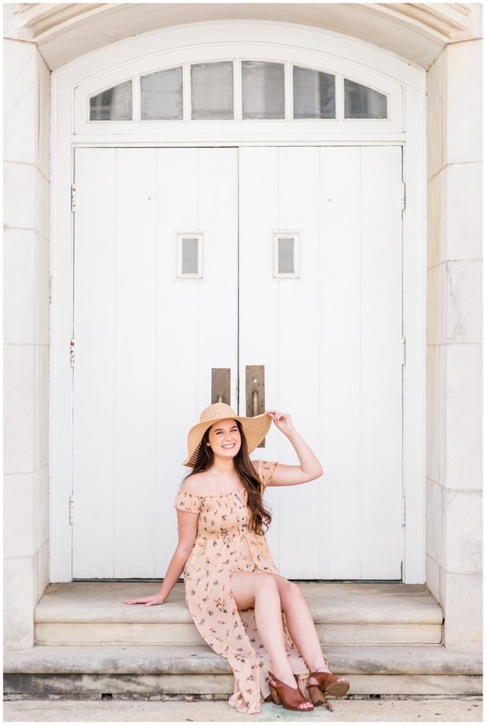 downtown senior session photo in pink maxi dress and floppy hat