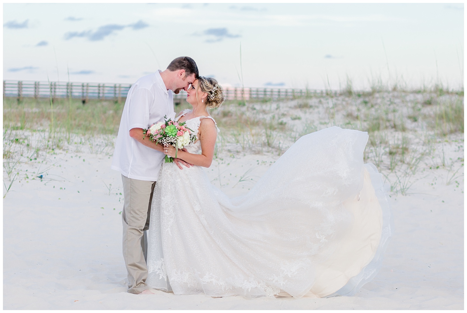 orange beach alabama destination wedding photo on sand dunes with fairytale wedding dress