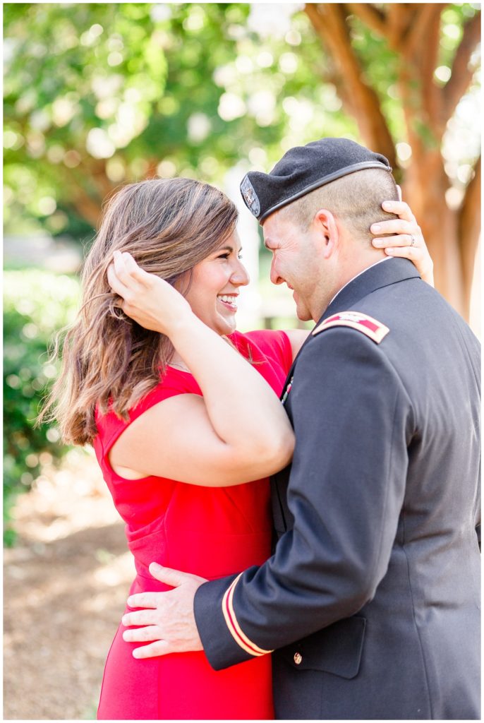 downtown engagement session in military uniform and bright red dress