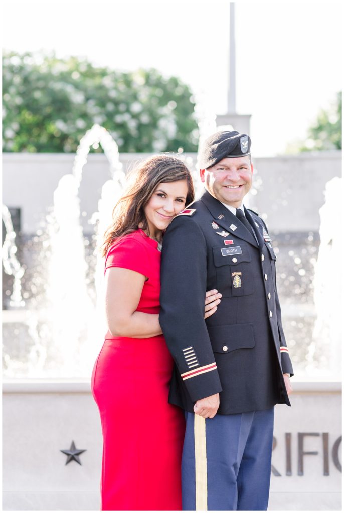 downtown engagement session in military uniform and bright red dress