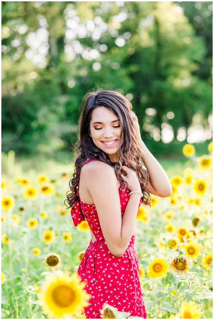 sunflower patch senior session in bright red dress