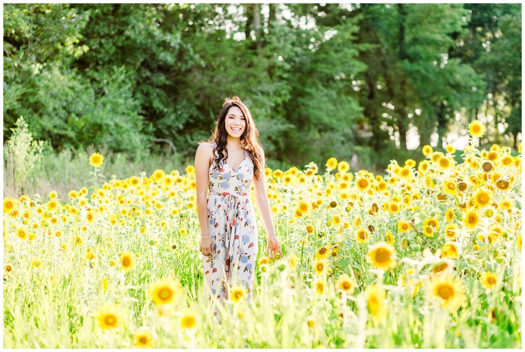 sunflower patch senior session in floral dress at sunset