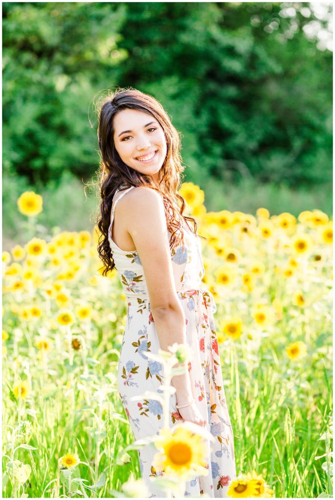 sunflower patch senior session in floral dress at sunset