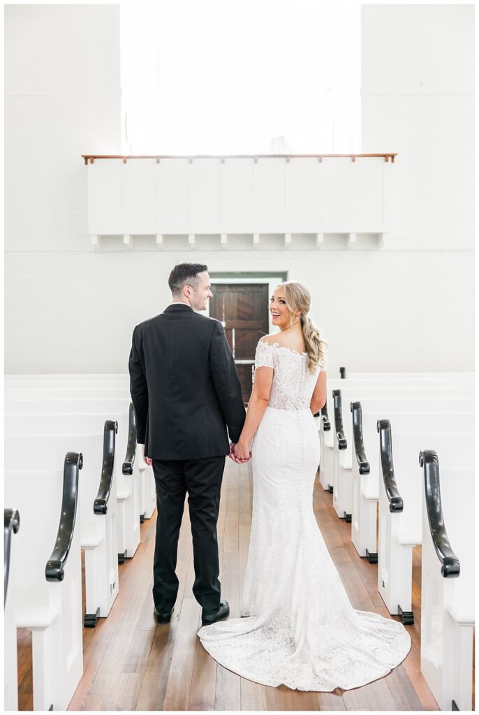 bride and groom walking down aisle at chapel at seaside