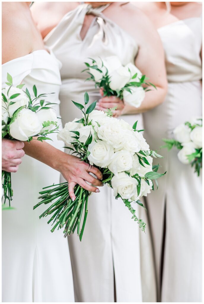 white rose bouquets with champagne bridesmaids dresses