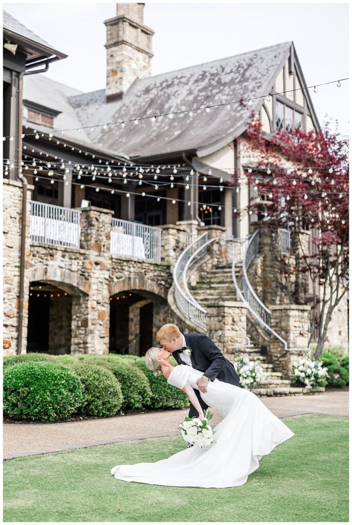 bride and groom by stairs at the ledges club