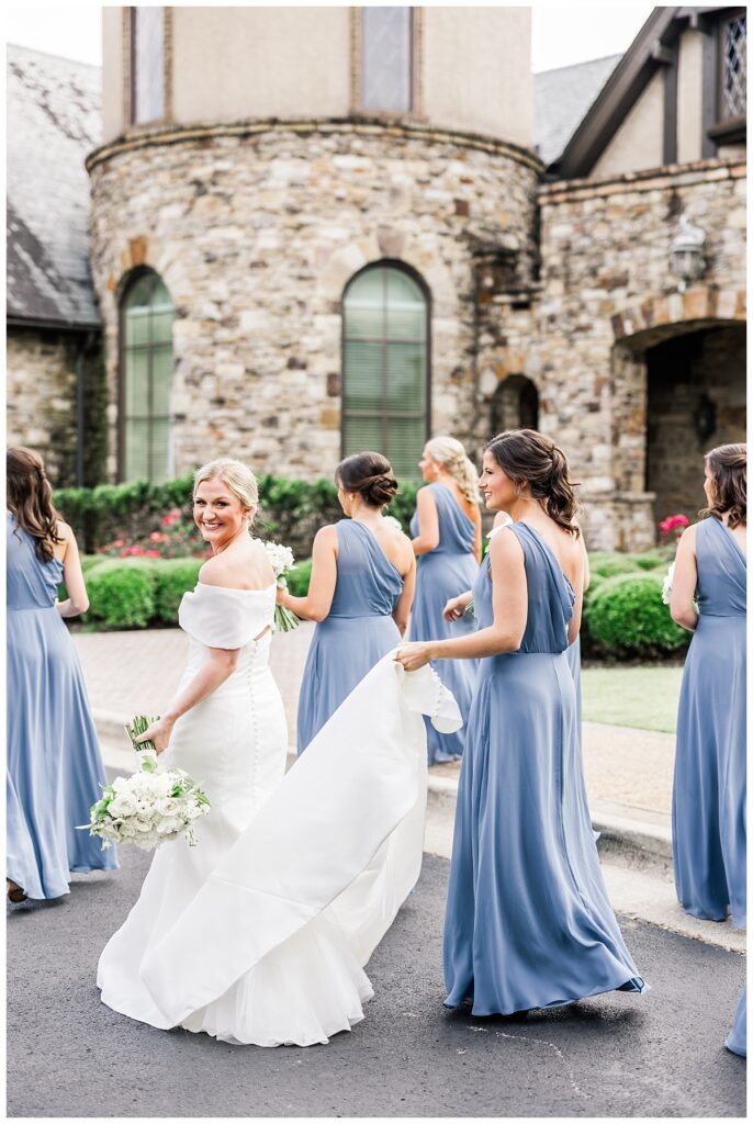 bride with bridesmaid in blue at the ledges club huntsville