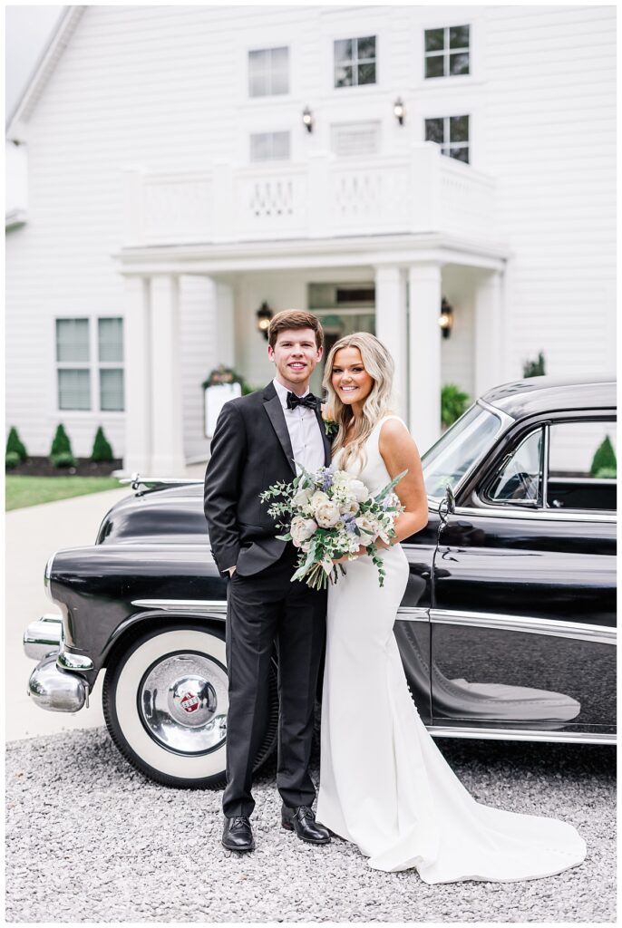 bride and groom by vintage car at harvest hollow