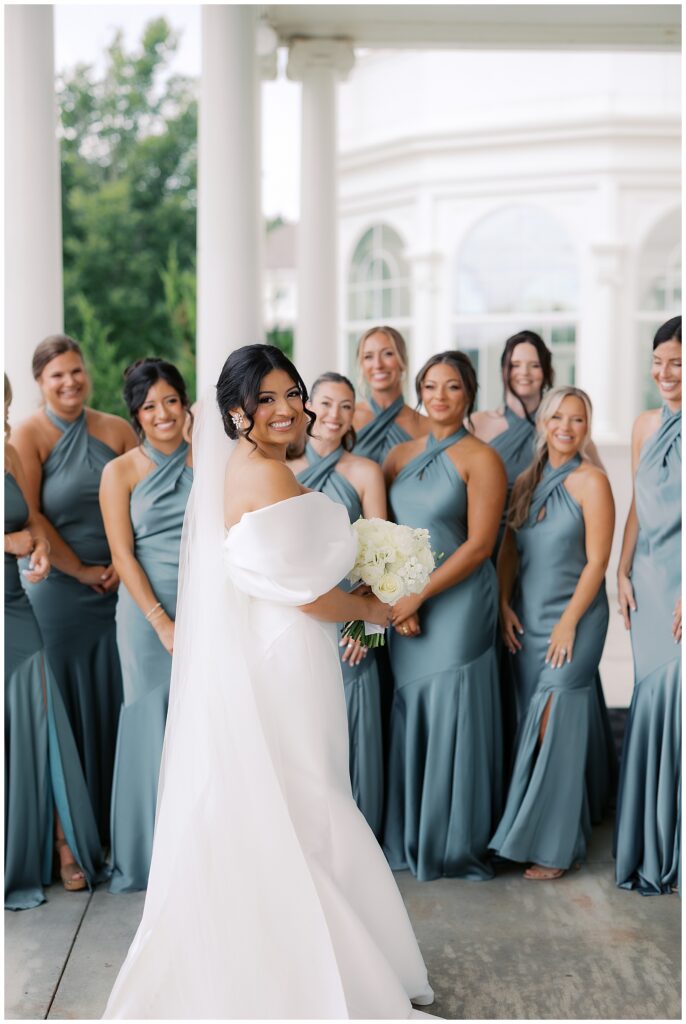 bride first look with bridesmaids