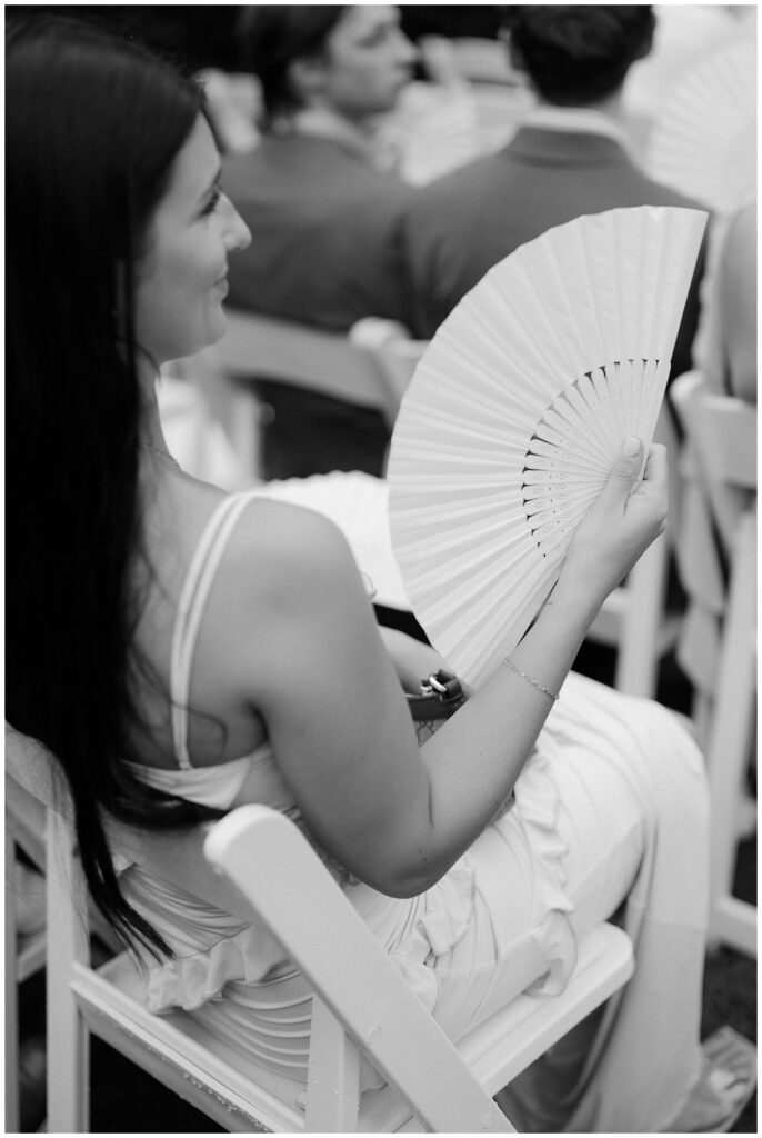 fans at summer wedding ceremony